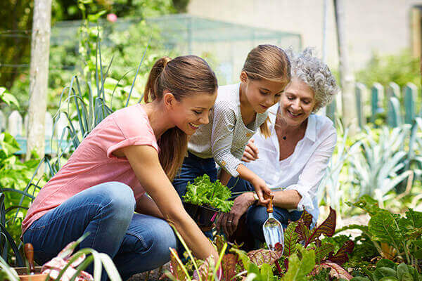 three generations of women gardening