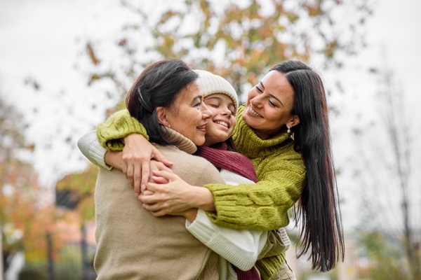 Three generations of women embracing
